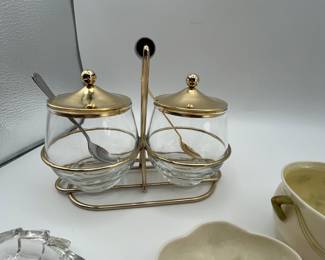 This is a lot that includes three sets of table setting salt & pepper shakers, two Belleek Shamrock serving dishes, vintage MCM Midcentury Modern Condiment Serving Set (Libbey) and a small crystal trinket dish. A lot of wonderful treasures!
See items descriptions and photos for condition details.