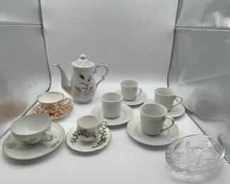 This is a beautiful lot for a tea party! A set of four white tea cups and saucers, a tea pot and three unique cups and saucers. Also included is a small crystal trinket dish.
See items descriptions and photos for condition details.
