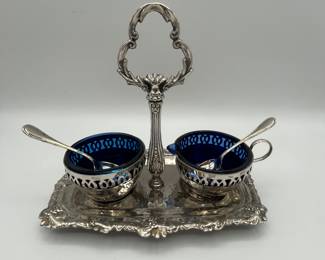 Beautiful vintage condiment server made of white metal and cobalt glass, made in England. Also included is a very unique marble salt and pepper shaker, one piece with salt on one side and pepper on the other. Finally, an antique miniature salt and pepper shaker set measuring at .26ozt. Don’t let this beautiful lot slip by!
See items descriptions and photos for condition details.