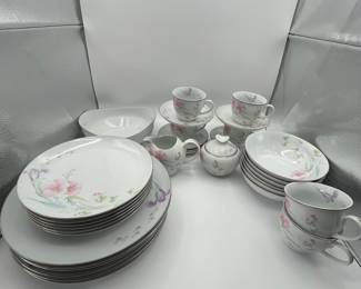Complete set of vintage porcelain dinnerware featuring floral patterns. Includes dinner plates, tea cups, saucers, cream jug, sugar bowl, and serving dishes. Service for eight, perfect for bridal showers, weddings and other gatherings.
See items descriptions and photos for condition details.