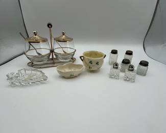 This is a lot that includes three sets of table setting salt & pepper shakers, two Belleek Shamrock serving dishes, vintage MCM Midcentury Modern Condiment Serving Set (Libbey) and a small crystal trinket dish. A lot of wonderful treasures!
See items descriptions and photos for condition details.