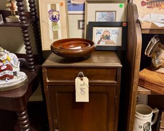 cabinet with wood bowls and duck commemorative stamp print