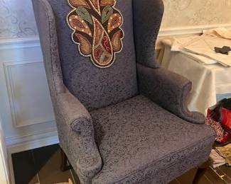 The other blue wing back chair