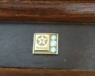 On top of clock. Given in 1987 . Think diamonds.