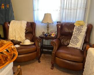 Pair of leather reclining chairs, they are as is very loose goosy $50 each