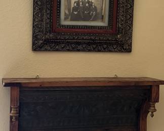 Framed antique photo and wall shelf