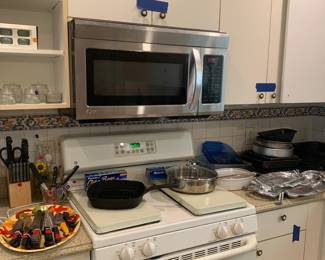 Appliances not for sale, but the counters are covered in cookware and dishware