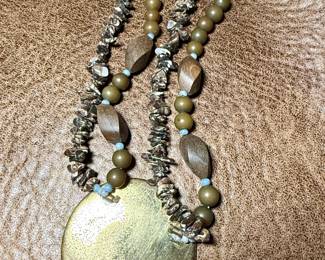 Goldtone medallion with gemstone necklace