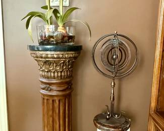 Two Pedestals with Amaryllis and a Metal Armillary Sphere
