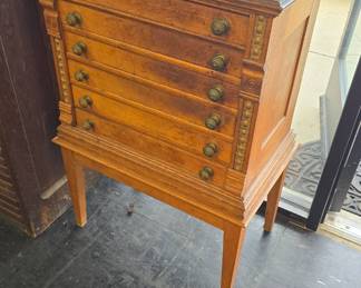 Antique spool cabinet on legs ? clarks?