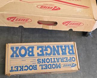 vintage model rocket boxes with contents