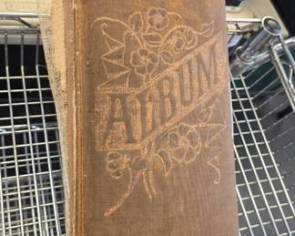 antique photo album full of black and whites