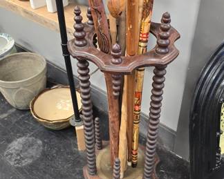Antique spindled umbrella rack with walking sticks and more