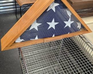 folded American flag in display case