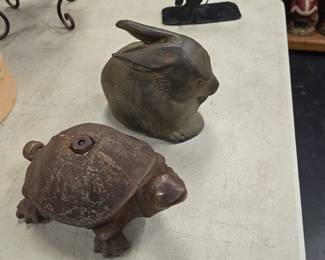 heavy cast iron bunny and a water sprinkler turtle