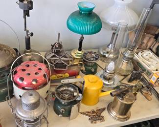 nice collection of vintage lanterns, jerry cans, railroad lights, military, lanterns, oil lamps, cookstoves and ammo boxes.