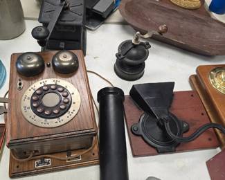 vintage coffee grinders and telephones