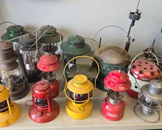 nice collection of vintage lanterns, jerry cans, railroad lights, military lanterns, cookstoves and ammo box's.