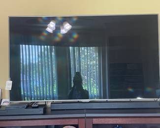Samsung TV with soundbar and remote