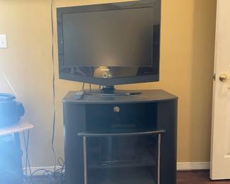 32" TV with soundbar and cabinet