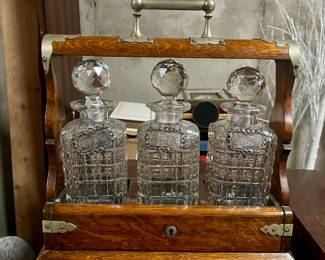 Beautiful oak Tantalus liquor cabinet with crystal cut glass decanters