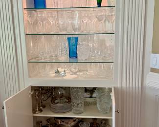 Cabinet full of glass and silver