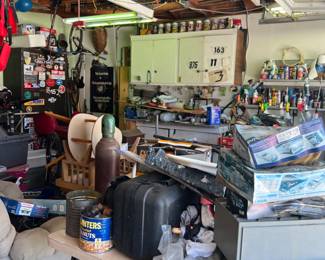 garage is filled with construction items, tools, tool boxes & misc. items left over from home remodel.