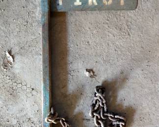 Metal "Safety First" Sign with Post and Chain