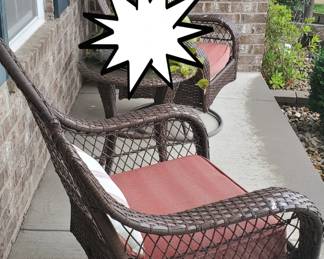 (2) Rocking wicker chairs, round wicker table, and the tall plant in the corner