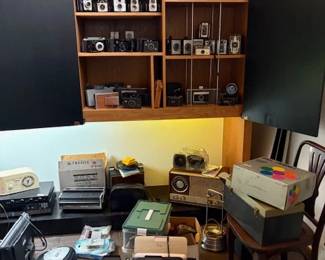 Vintage cameras of all kinds plus radios and miscellaneous electronics.