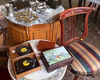 Capodimonte table, music boxes, Michael Aram pieces, chairs, marble top side tables.