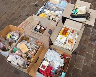 Boxes of dollhouse furniture and miniatures