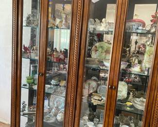 Large curio cabinet, mirrored back panel with lights and filled with treasures, Santa collection tea cups, Asian Ginger Jars and MORE