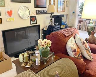 Den filled with artwork, electronics, Sanyo TV 48 inches and MORE