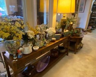 Sofa table with bamboo trim, pottery, decorative