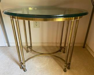 Brass occasional end table with oval beveled glass top