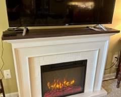 Excellent, like-new condition electric fireplace with mantle in great working order; Use with or without heat, provides heat for rooms up to 400-1000 sq.ft. Dimensions: 47.5"w x 1' d x 3'tall $500.00