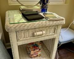 White wicker bedside table with glass top; signs of wear but could be repainted $45; A nicer pair of white wicker bedside tables also available but not photographed $125/pair
