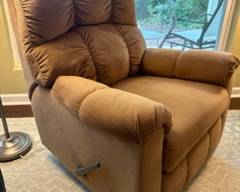 Brown upholstered manual recliner, good working condition; smoke and pet free $150