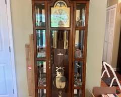 Howard Miller Grandfather Clock in good working order with side, glass-front curio cabinets $450