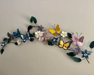 Metal wall art with flowers and butterflies $25