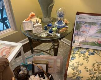 Tons of beach decor- framed art, shells, coasters, glass paperweights,
And clock