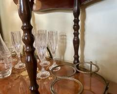 3 Brass bottle holders on bar cart/trolley
