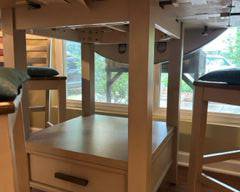 Storage drawer and shelf below the table