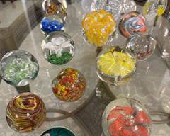 Collection of glass paper weights, prices vary