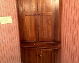 Gorgeous cherry corner cupboard... this is truly a stunning piece that would make any room in your house more attractive...tons of storage space!