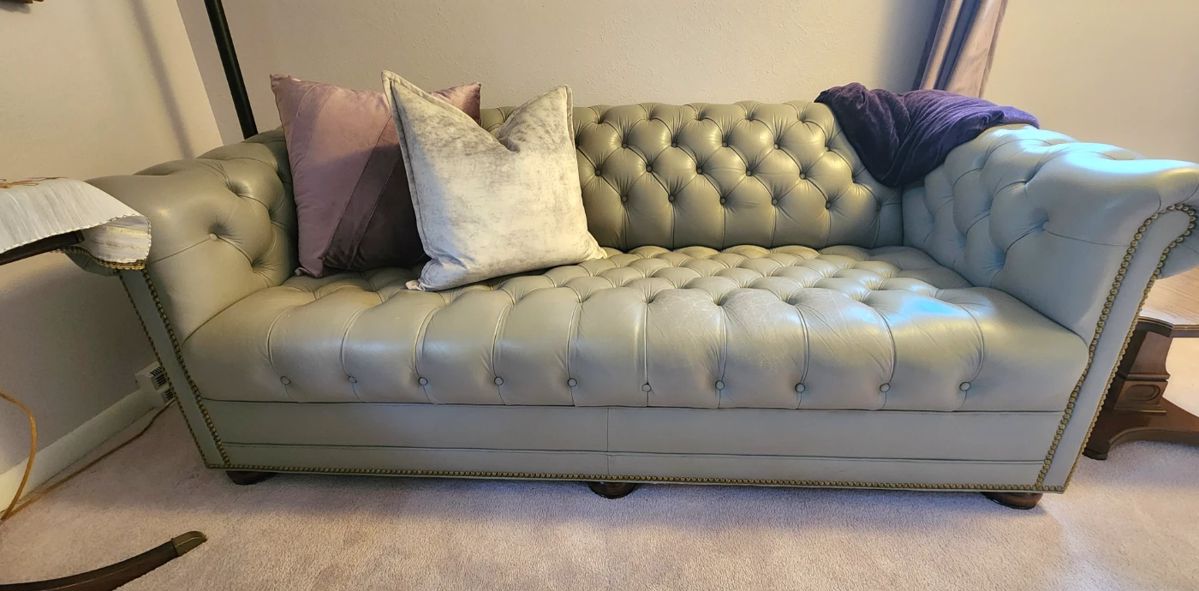 Gray leather Chesterfield sofa
