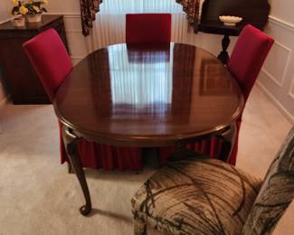 Cherry dining table with leaves and table protector. (6 parsons chairs available)