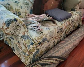 Couch, rug, table and hangers