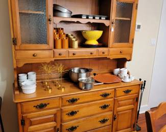 Gorgeous cabinet in the dining room can be used as a coffee station